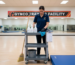 Staff prepping cleaning tools for gym mat maintenance