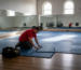 Technician installing interlocking modular gym mats